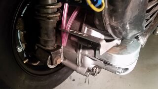 Carburettor overflow hoses bracket